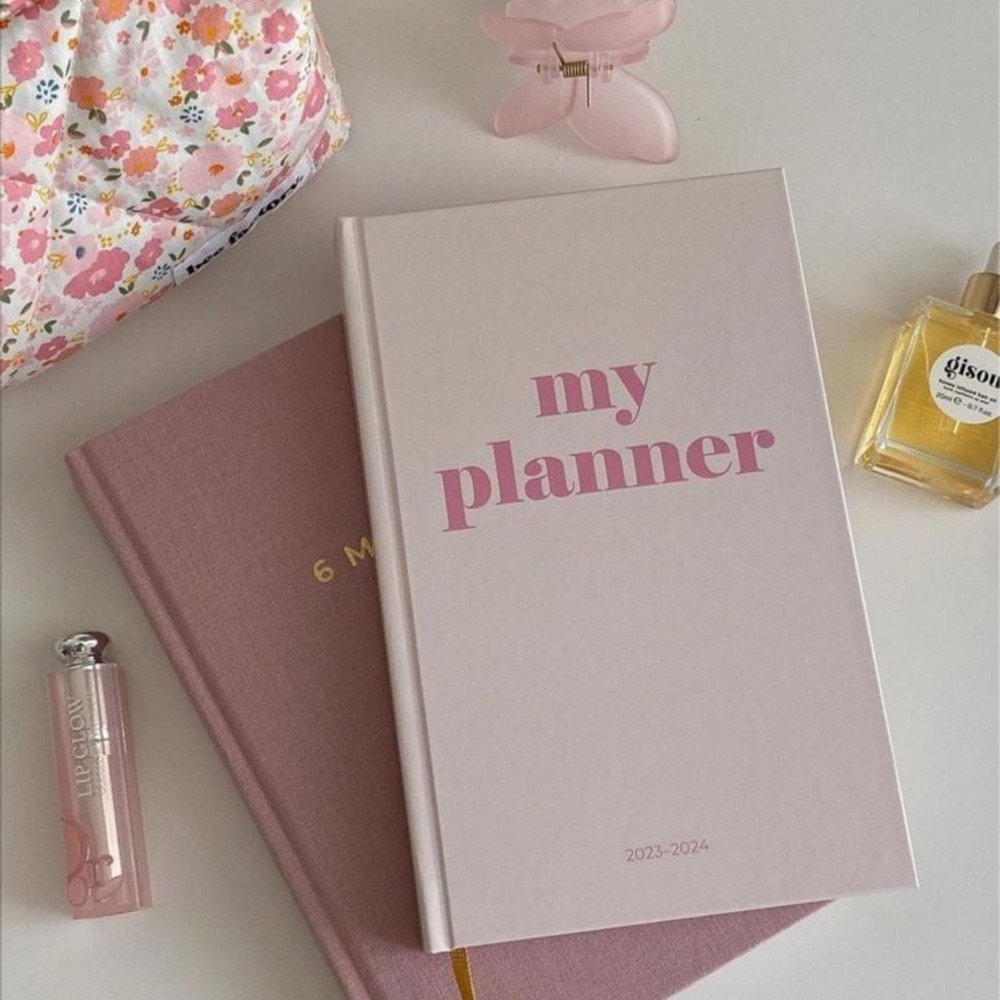 Pink planner notebook on a desk