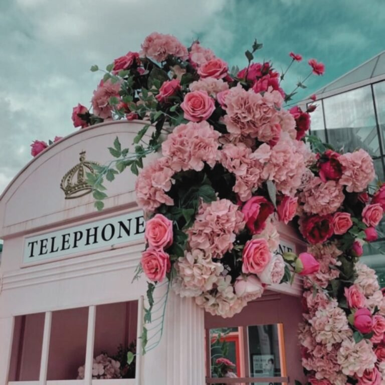 Shopfront covered in pink flowers